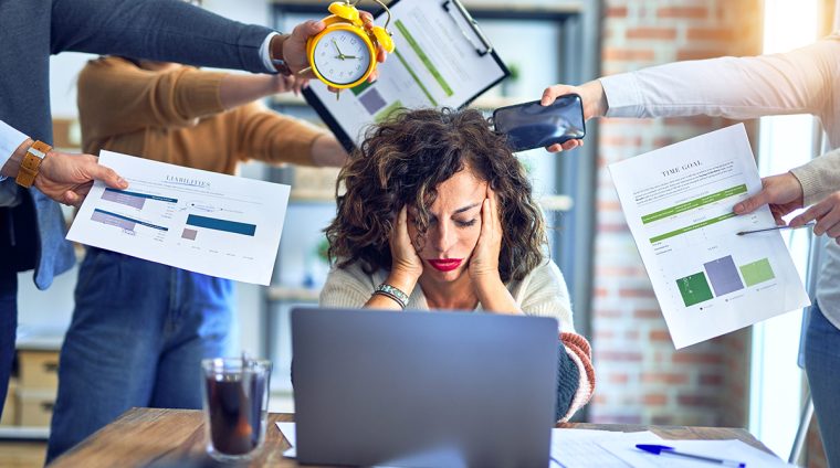 Group of business workers working together. Partners stressing one of them at the office