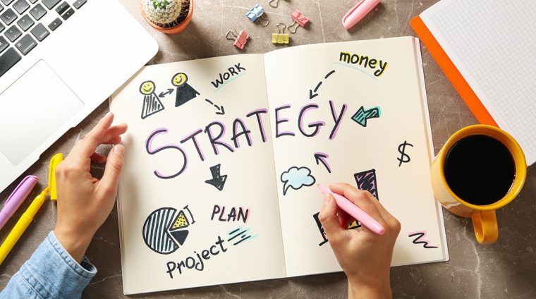Concept of business strategy on gray table, top view